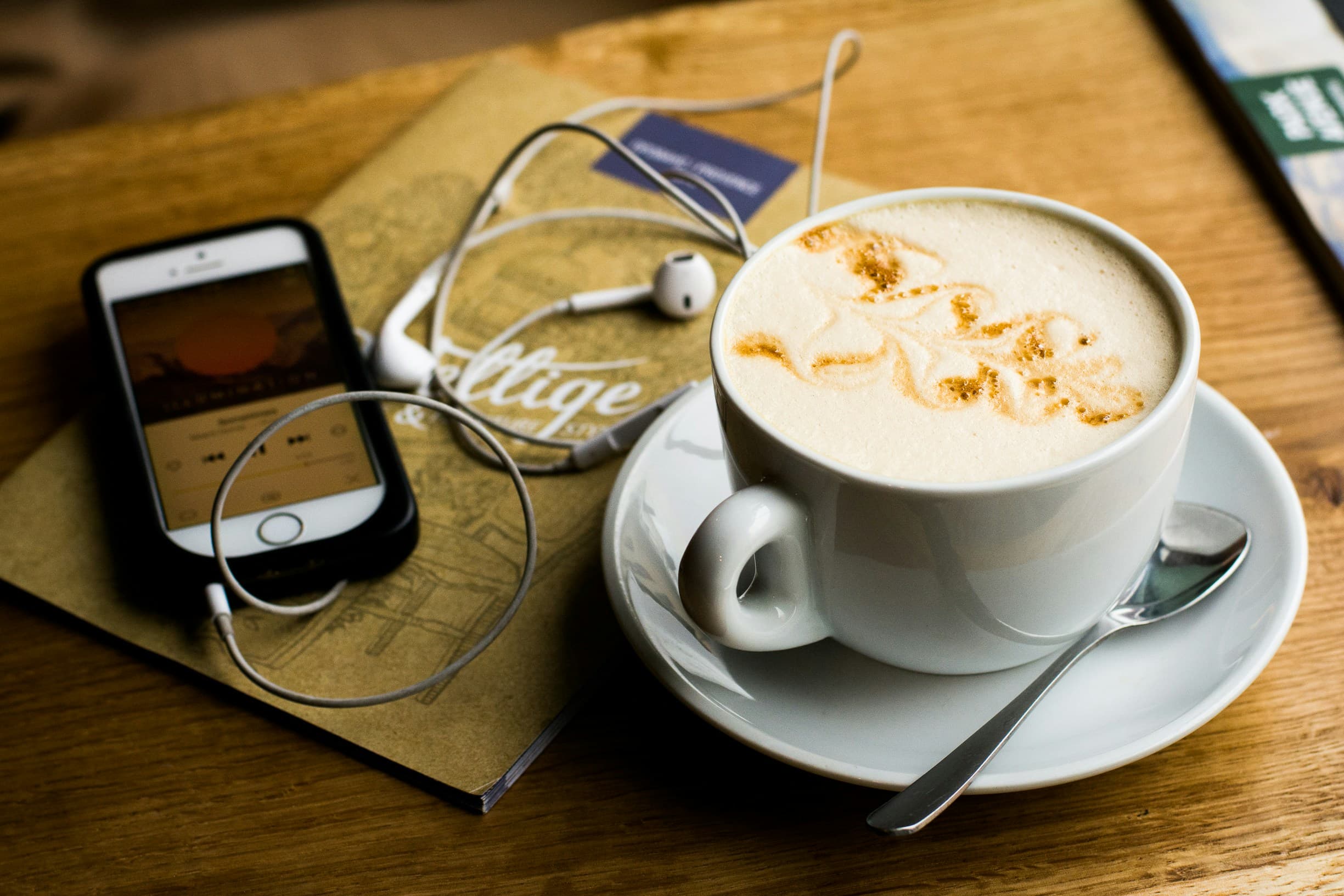 listening to podcast with cup of coffee