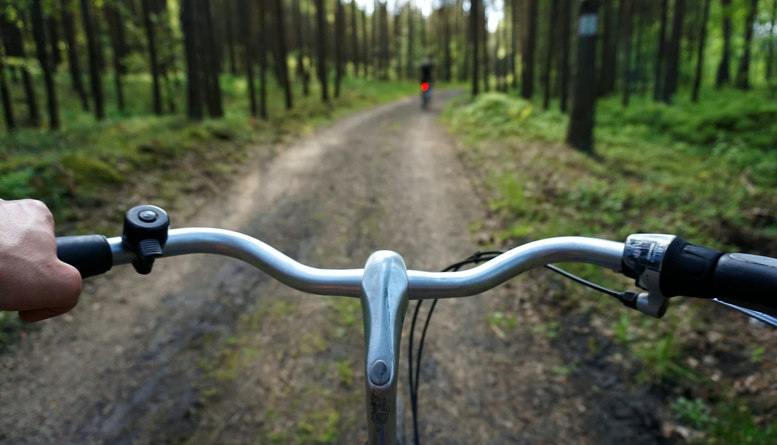 riding a bike on a trail