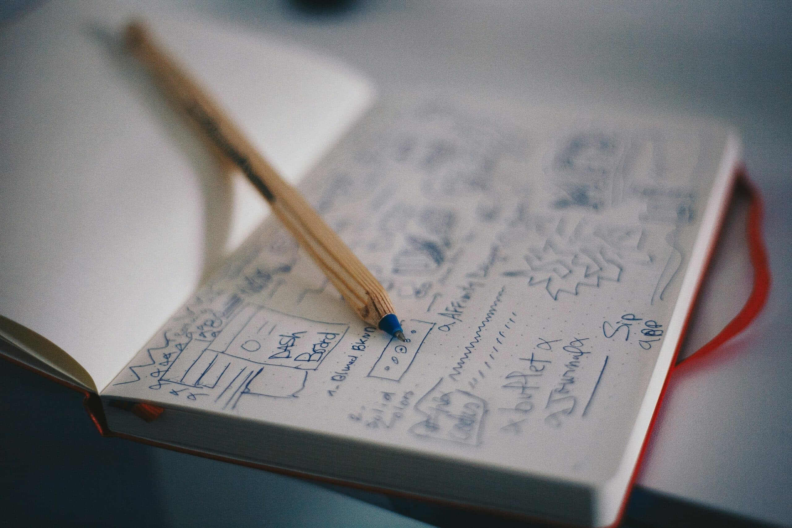 product designs in a notebook